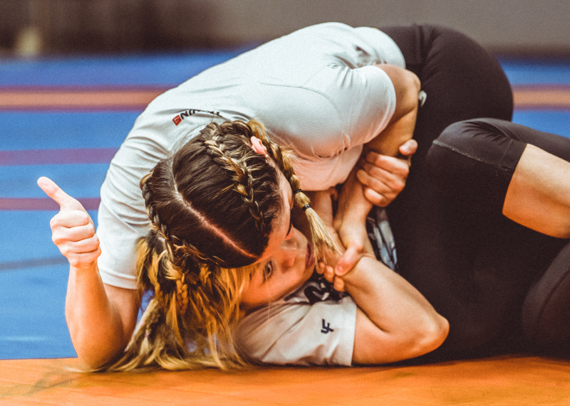 Tesshin athlete gives a thumbs up gesture mid BJJ no-gi fight