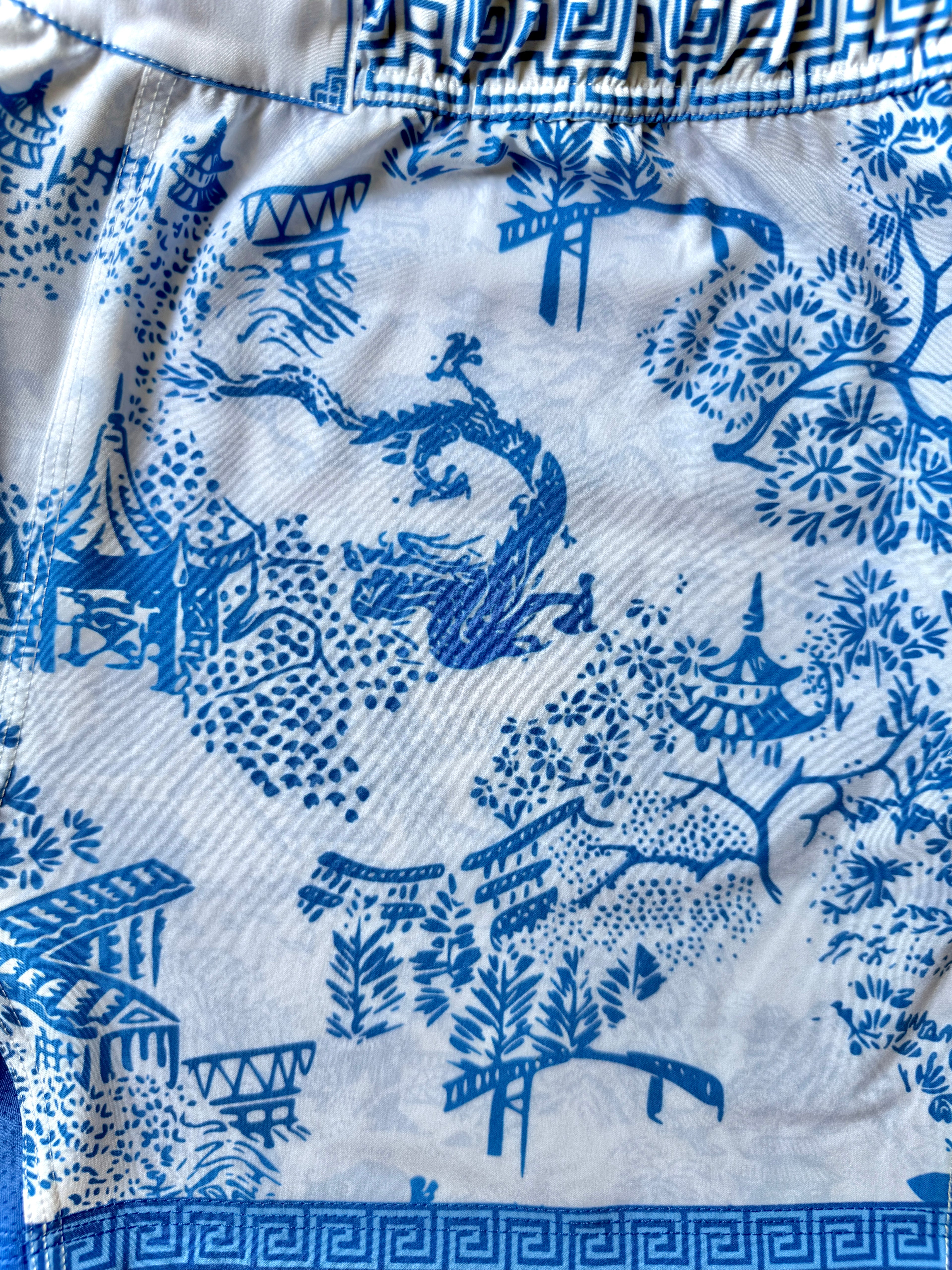 Close-up view of double layer art print on Tesshin Porcelain Fight Shorts