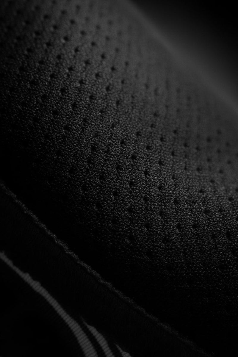 Close-up of shoulder mesh on Tesshin black rash guard